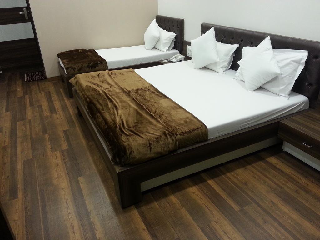Hotel Oasis Bombaim Quarto foto