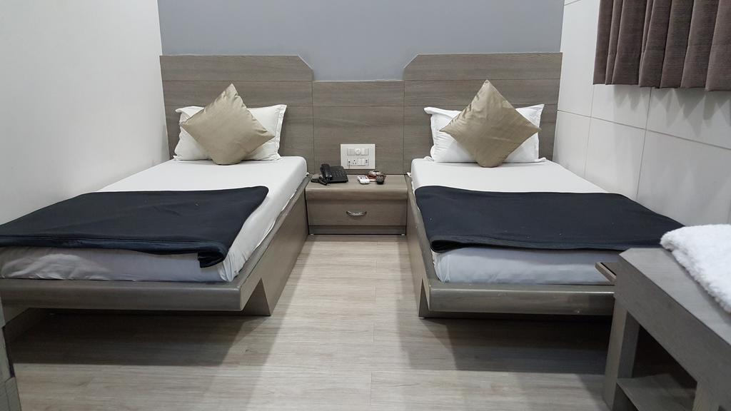 Hotel Oasis Bombaim Quarto foto